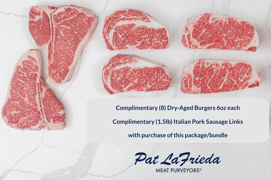 The Ultimate Dry-Aged Prime Steak Sampler with six premium cuts on marble, including complimentary dry-aged burgers and Italian pork sausage links.